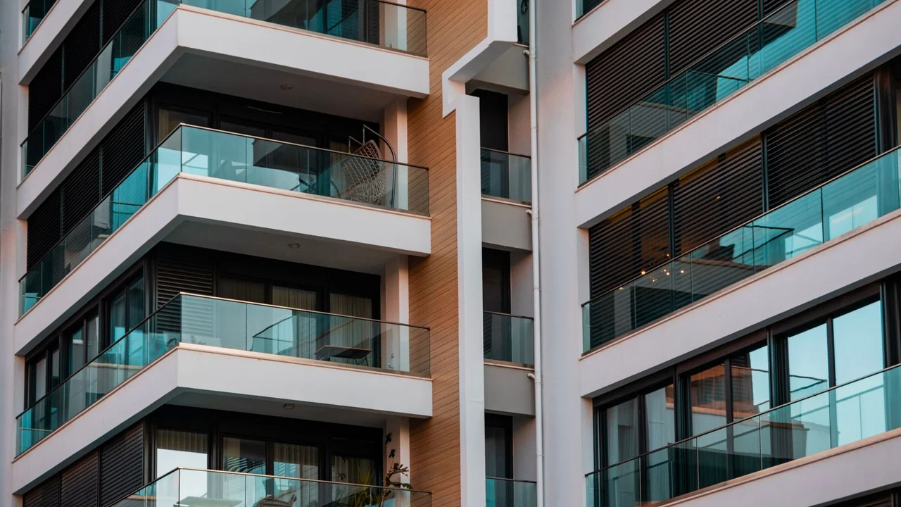 Contemporary architecture showcasing glass balconies and sleek design.